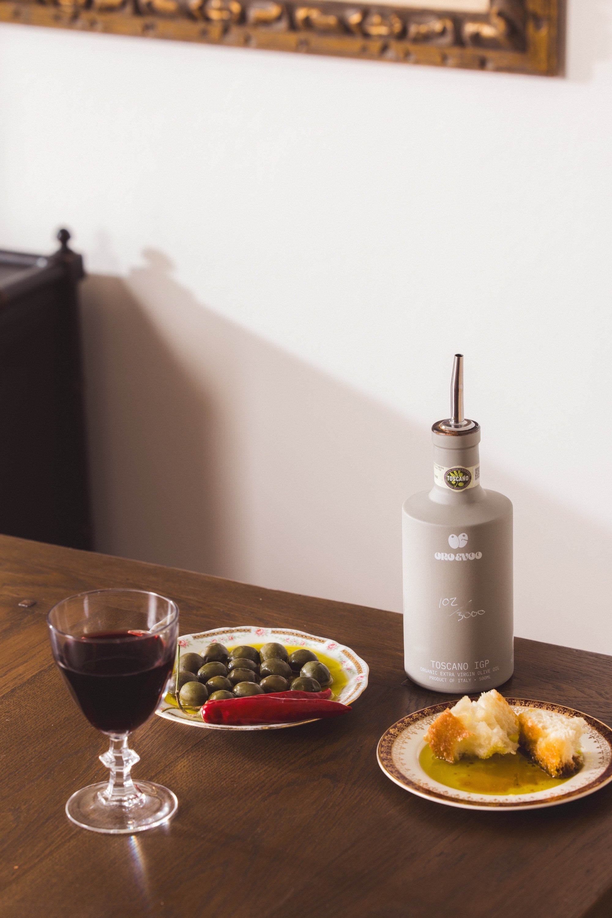Batch 01 on the table: bottle, olives and bread